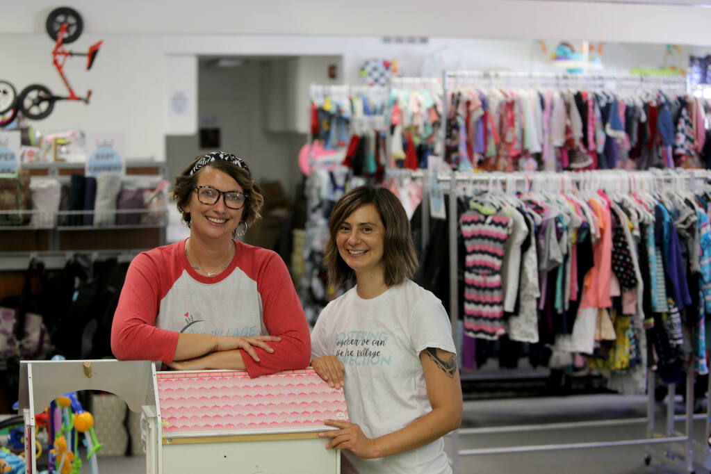 Co-founders Amanda Kitchens, left, and Dominique Soileau at Our Village Closet in Santa Rosa on Wednesday, July 21, 2021. (Beth Schlanker/The Press Democrat)