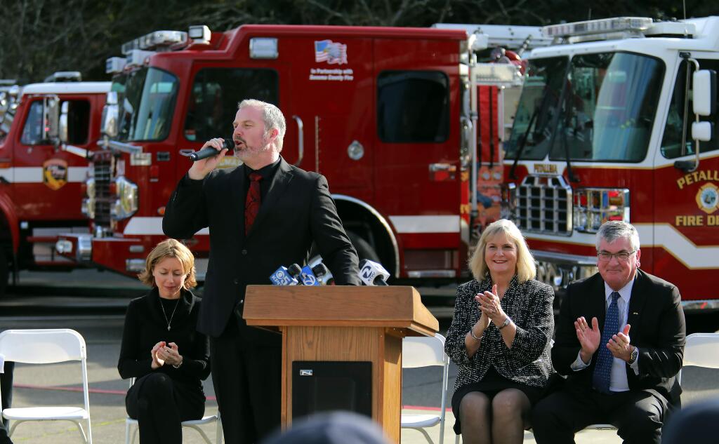 The new chairman of the Sonoma County Board of Supervisors, James Gore, conducts a ceremony to honor first responders who worked during the October wildfires in front of the supervisors chamber in Santa Rosa on Tuesday. (photo by John Burgess/The Press Democrat)