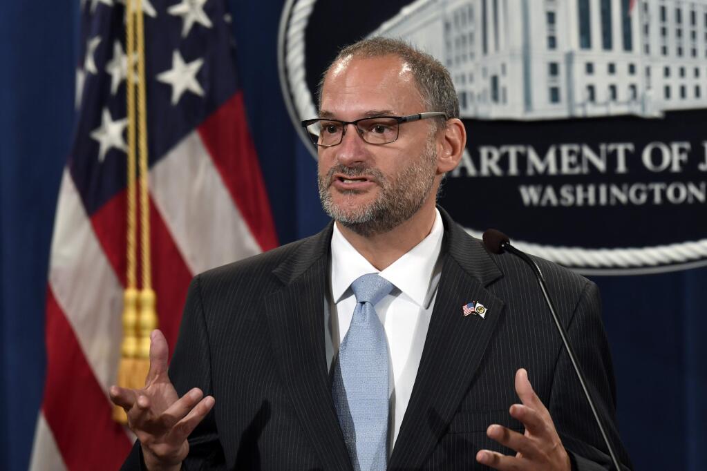 FILE - In this July 19, 2019, file photo, acting Director of the Bureau of Prisons Hugh Hurwitz speaks during a news conference at the Justice Department in Washington. Hurwitz has been removed from his post more than a week after millionaire financier Jeffrey Epstein took his own life while in federal custody. Attorney General William Barr announced Hugh Hurwitz's termination Monday, Aug. 19. (AP Photo/Susan Walsh, File)