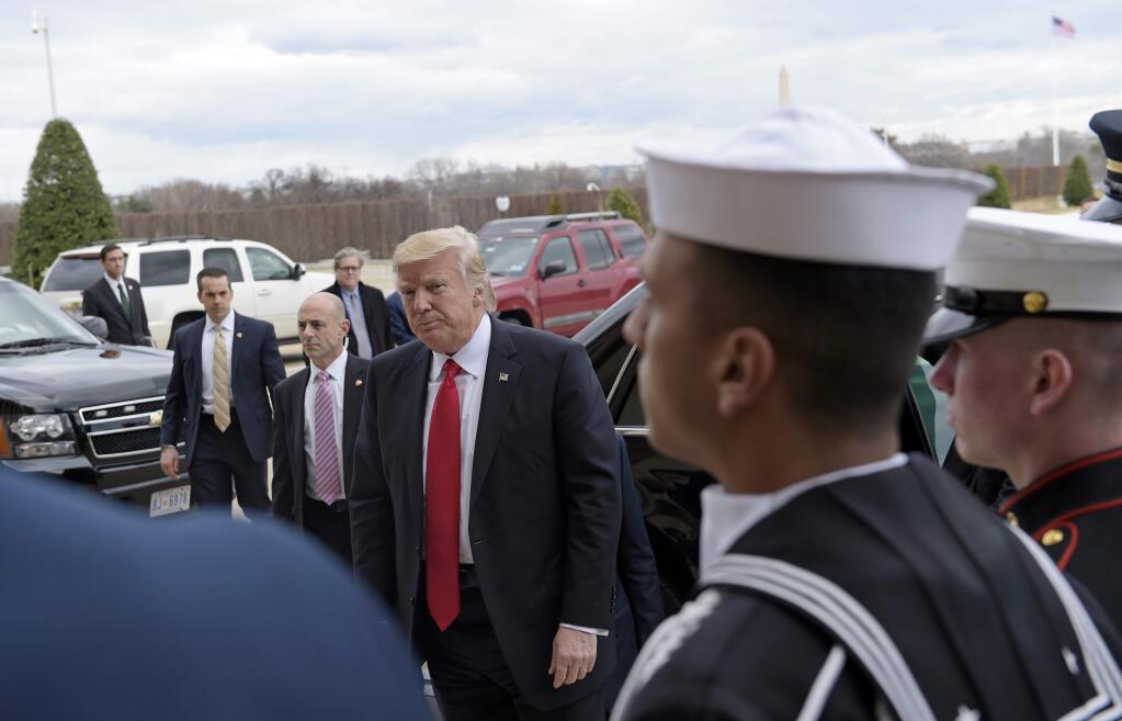 FILE - In this Jan. 27, 2017, file photo, President Donald Trump arrives at the Pentagon, for the ceremonial swearing-in for Defense Secretary James Mattis. (AP Photo/Susan Walsh, File)