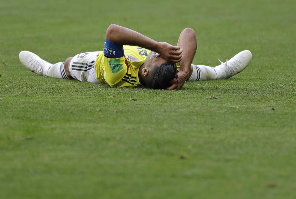 Colombia's Radamel Falcao lays on the pitch during the group H match between Colombia and Japan at the 2018 soccer World Cup in the Mordavia Arena in Saransk, Russia, Tuesday, June 19, 2018. (AP Photo/Natacha Pisarenko)