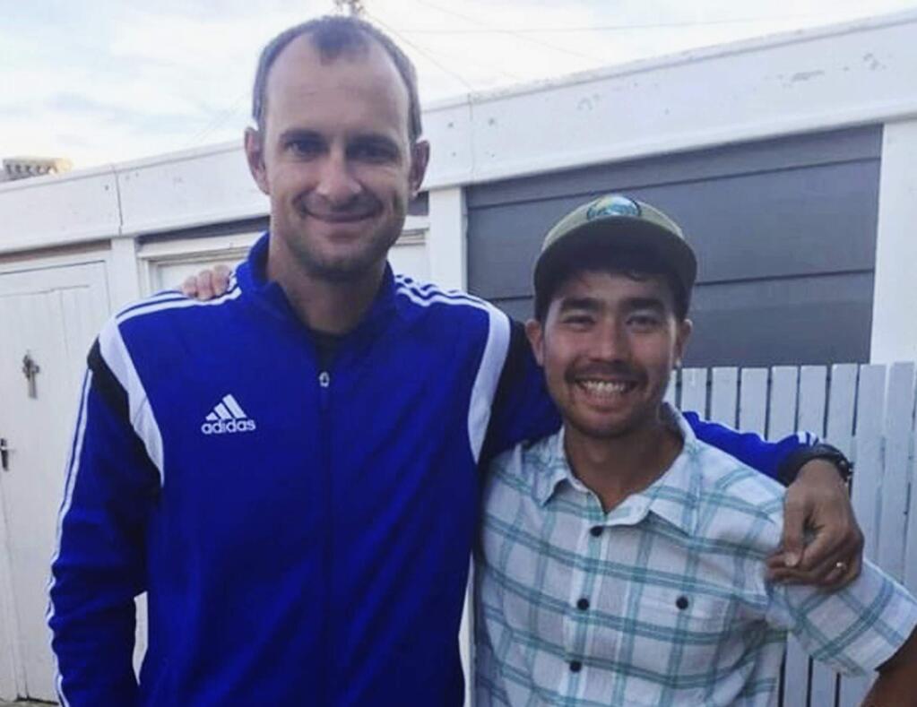 In this October 2018 photo, American adventurer John Allen Chau, right, stands for a photograph with Founder of Ubuntu Football Academy Casey Prince, 39, in Cape Town, South Africa, days before he left for in a remote Indian island of North Sentinel Island, where he was killed. Chau, who kayaked to the remote island populated by a tribe known for shooting at outsiders with bows and arrows, has been killed, police said Wednesday, Nov. 21. Officials said they were working with anthropologists to recover the body. (AP Photo/Sarah Prince)