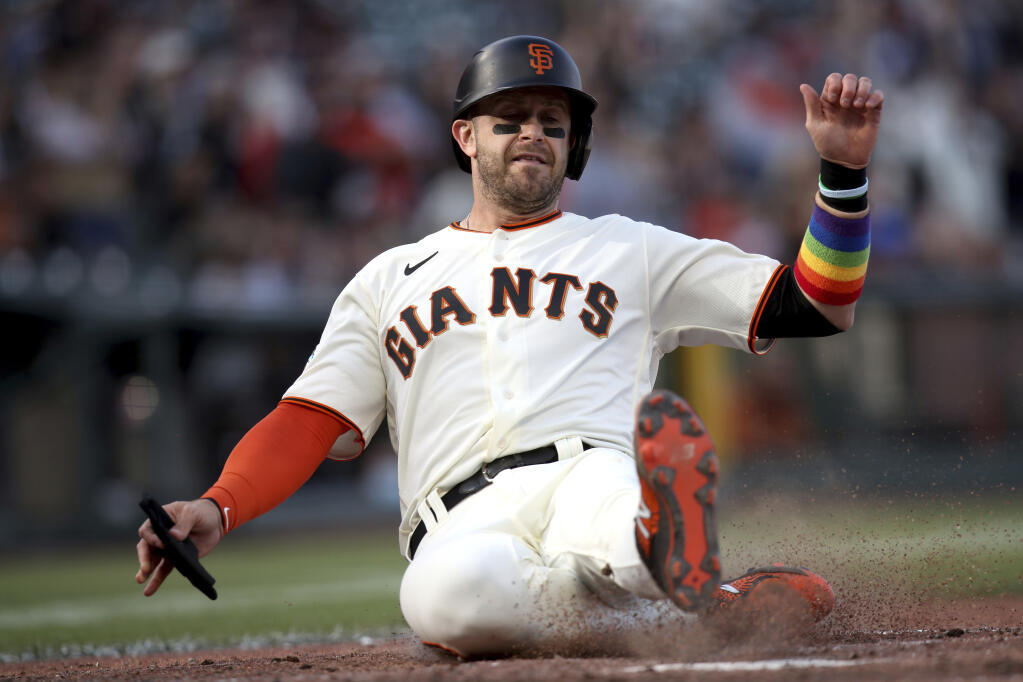 The Giants' Evan Longoria scores on a Brandon Crawford double during the fifth inning gainst the Chicago Cubs on Saturday, June 5, 2021, in San Francisco. (AP Photo/Scot Tucker)