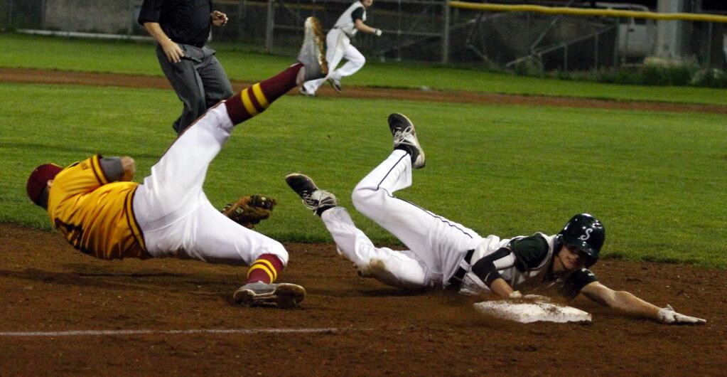 Bill Hoban/Index-TribuneSenior Will Lennon is tagged out on a bang-bang play at third base during the Dragons' nonleague loss to Vintage Tuesday night at Arnold Field.