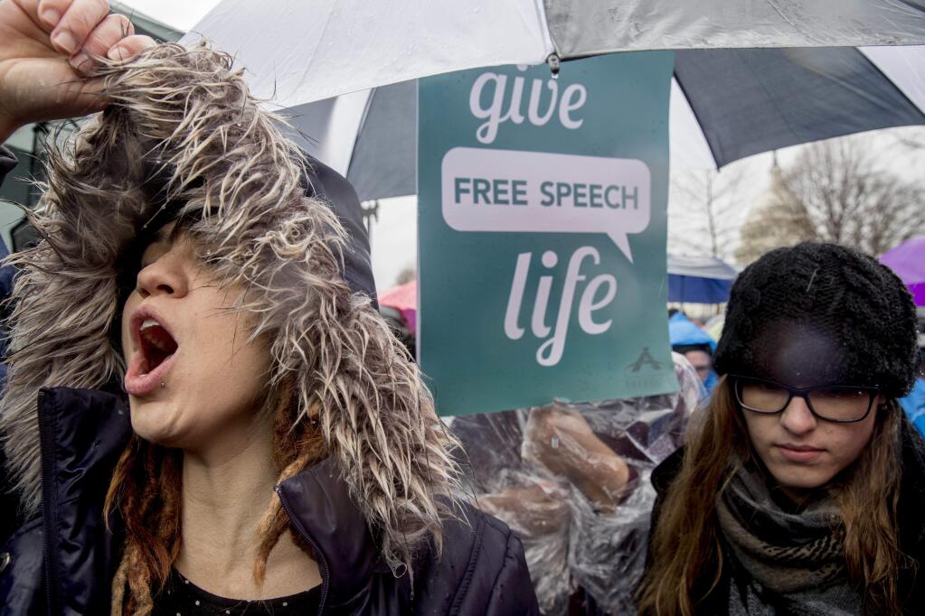 Anti-abortion demonstrators cheer during a rally outside the Supreme Court in Washington, Tuesday, March 20, 2018, as the Supreme Court hears arguments in a free speech fight over California's attempt to regulate anti-abortion crisis pregnancy centers. (AP Photo/Andrew Harnik)