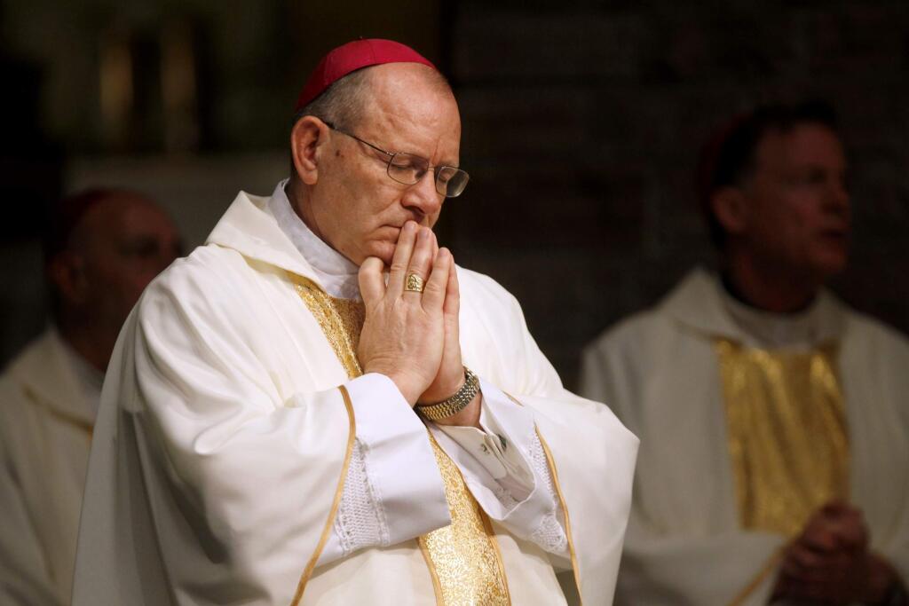 Rev. Robert Vasa, the new Coadjutor Bishop of Santa Rosa, closes his eyes in prayer during a mass for his reception at St. Eugene's Cathedral in Santa Rosa, California on Sunday, March 6, 2011. (BETH SCHLANKER/ The Press Democrat)