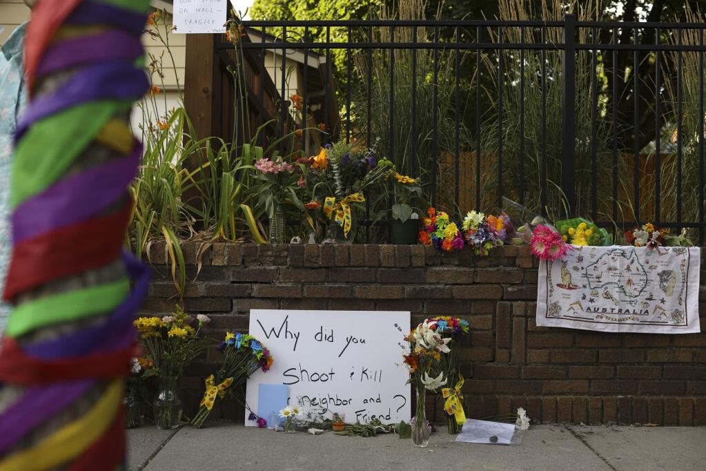 A memorial to an Australian woman who was shot and killed late Saturday by police, is seen Sunday evening, July 16, 2017 in Minneapolis. The Bureau of Criminal Apprehension released a statement Sunday saying two Minneapolis officers responded to a 911 call for a potential assault late Saturday. Exact details weren't released, but officials said an officer fired a gun, killing the woman. (Jeff Wheeler/Star Tribune via AP)