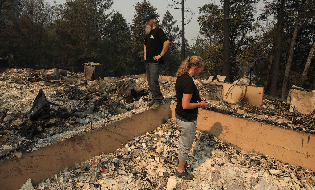 Andy and Liz Adams get the first look at their home that had been burned by the Glass fire on 1930 Los Alamos Road, Tuesday, Sept. 30, 2020. (Kent Porter / The Press Democrat) 2020