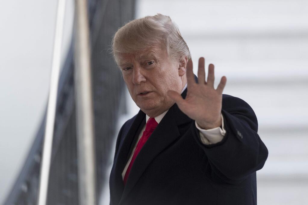 President Donald Trump waves as arrives at the White House in Washington, Thursday, Jan. 18, 2018, as he returns from Pittsburgh, Pa. (AP Photo/Carolyn Kaster)