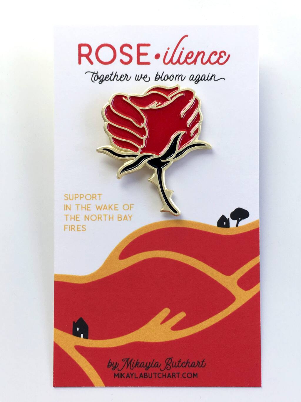 Mikayla Butchart's 'Roseilience' pin, formed by two clasping hands, is a symbol of hope.