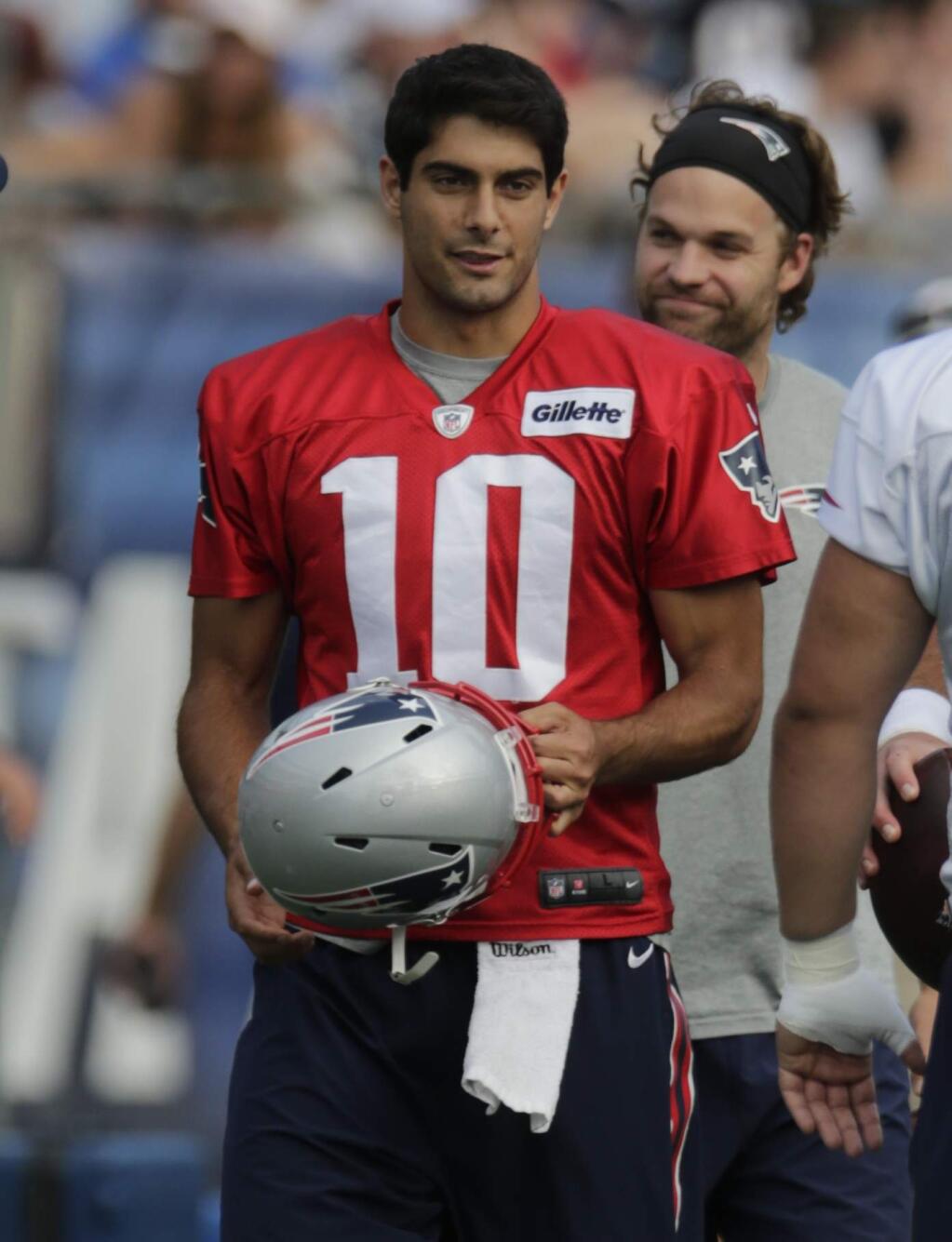 New England Patriots quarterback Jimmy Garoppolo gets ready to practice during training camp in Foxborough, Mass., Wednesday, Aug. 5, 2015. (AP Photo/Charles Krupa)