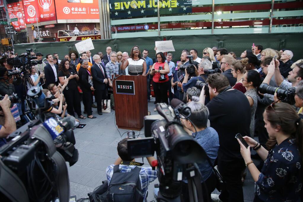New York City Public Advocate Letitia James speaks to protestors gathered in Times Square, Wednesday, July 26, 2017, in New York. A rally was held in Times Square after President Donald Trump's announcement of a ban on transgender troops serving anywhere in the U.S. military. (AP Photo/Frank Franklin II)