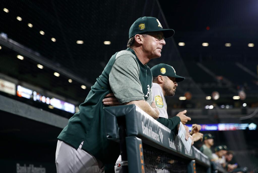 Oakland Athletics manager Bob Melvin stands in the dugout during a game against the Baltimore Orioles, Thursday, Sept. 13, 2018, in Baltimore. (AP Photo/Patrick Semansky)
