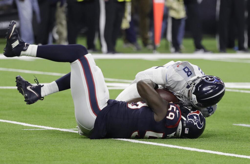 FILE - In this Nov. 26, 2018, file photo, Houston Texans outside linebacker Whitney Mercilus (59) sacks Tennessee Titans quarterback Marcus Mariota (8) during the second half of an NFL football game in Houston. Mercilus has been a stud so far, while edge rusher J.J Watt is off to a relatively slow start. (AP Photo/David J. Phillip, File)