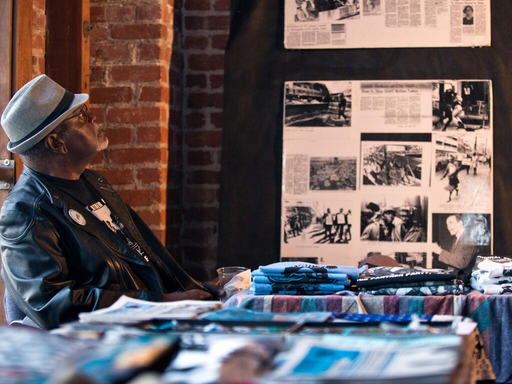 Elbert 'Big Man' Howard looks up at memorabilia from the height of the Black Panthers movement during the 47th anniversary celebration of the Black Panther Party founding in Santa Rosa in 2013. (ALVIN JORNADA/ PD FILE)