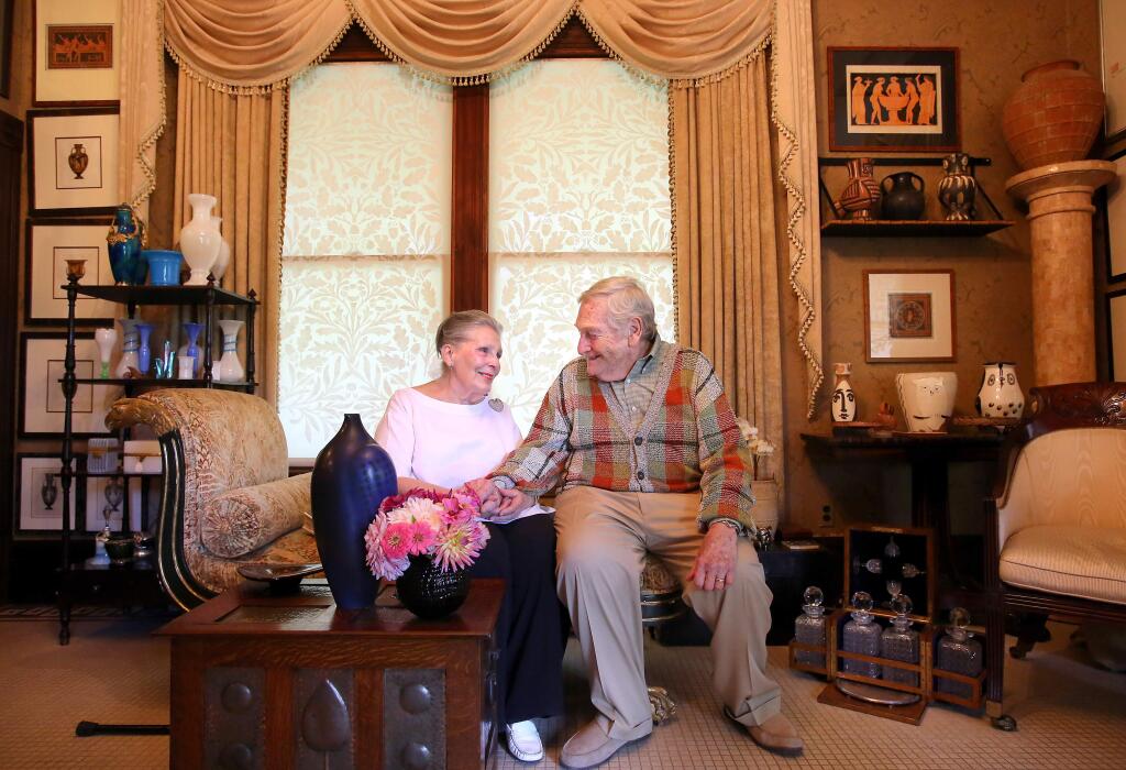 Barry and Audrey Sterling, co-founders of Iron Horse Vineyards, sit in a room filled with antique Egyptian pottery and art, and works by Pablo Picasso, who was their neighbor when they lived in France. The couple has been married for 62 years. (Christopher Chung / The Press Democrat)