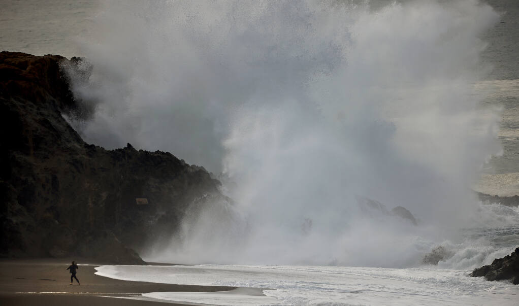 Coupled with a heavy surf and a tsunami advisory for the West Coast, large waves crash ashore at Wrights Beach and Duncan's Landing, Saturday, Jan. 15, 2022, north of Bodega Bay.   (Kent Porter / The Press Democrat)