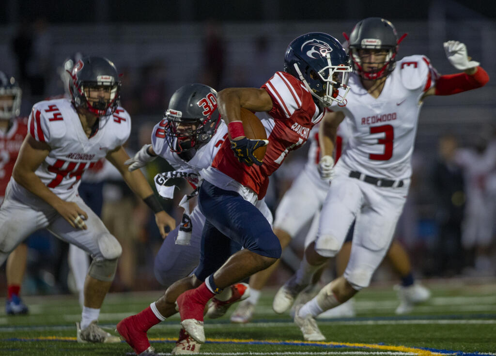 Rancho Cotate’s Sailasa Vadrawale sprints past the Redwood defense in the second quarter during their Sept. 2 game in Rohnert Park. (Chad Surmick / The Press Democrat)