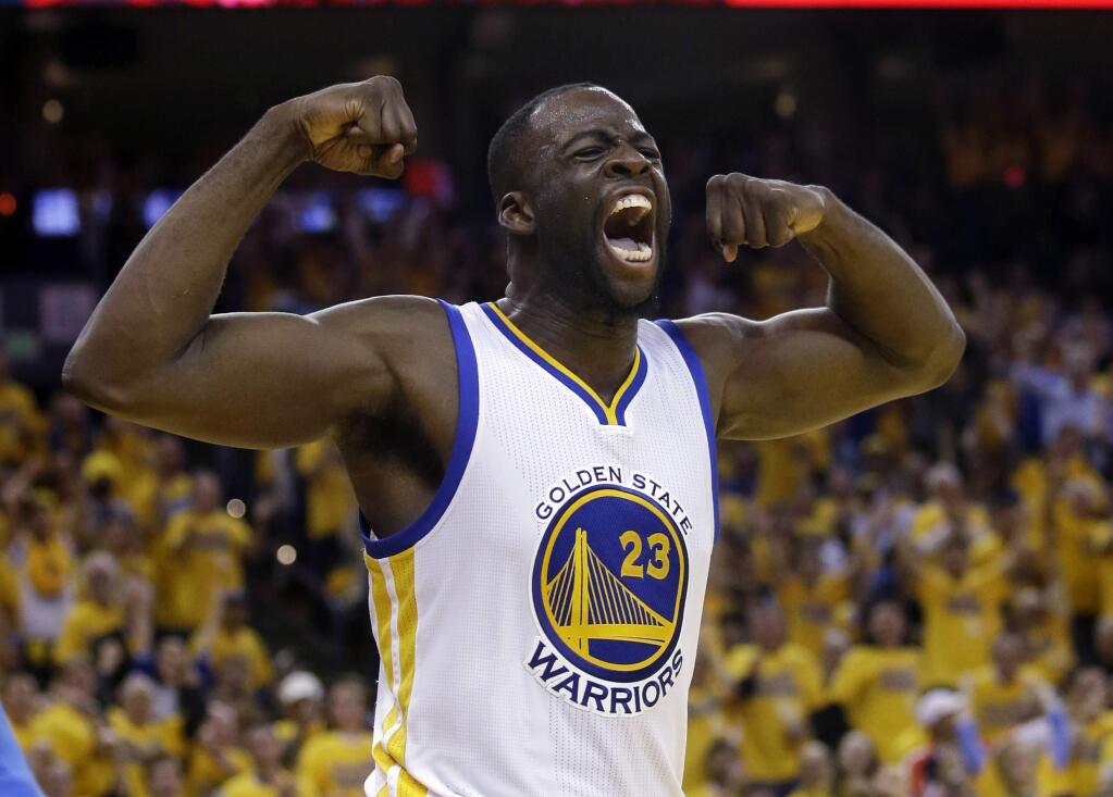 In this May 26, 2016, file photo, Golden State Warriors' forward Draymond Green celebrates after scoring against the Oklahoma City Thunder. (AP Photo/Marcio Jose Sanchez, File)