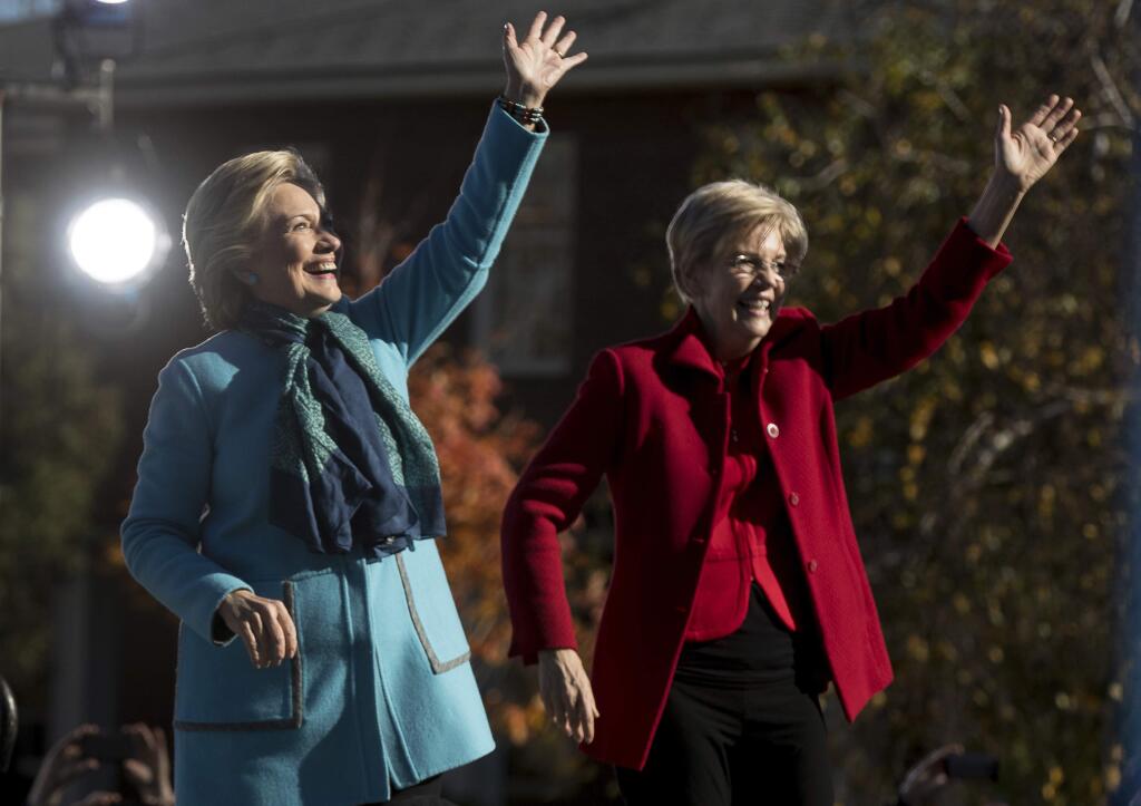 Democratic presidential candidate Hillary Clinton and Sen. Elizabeth Warren, D-Mass. depart after speaking at a rally at St. Anselm College in Manchester, N.H., Monday, Oct. 24, 2016. (AP Photo/Andrew Harnik)