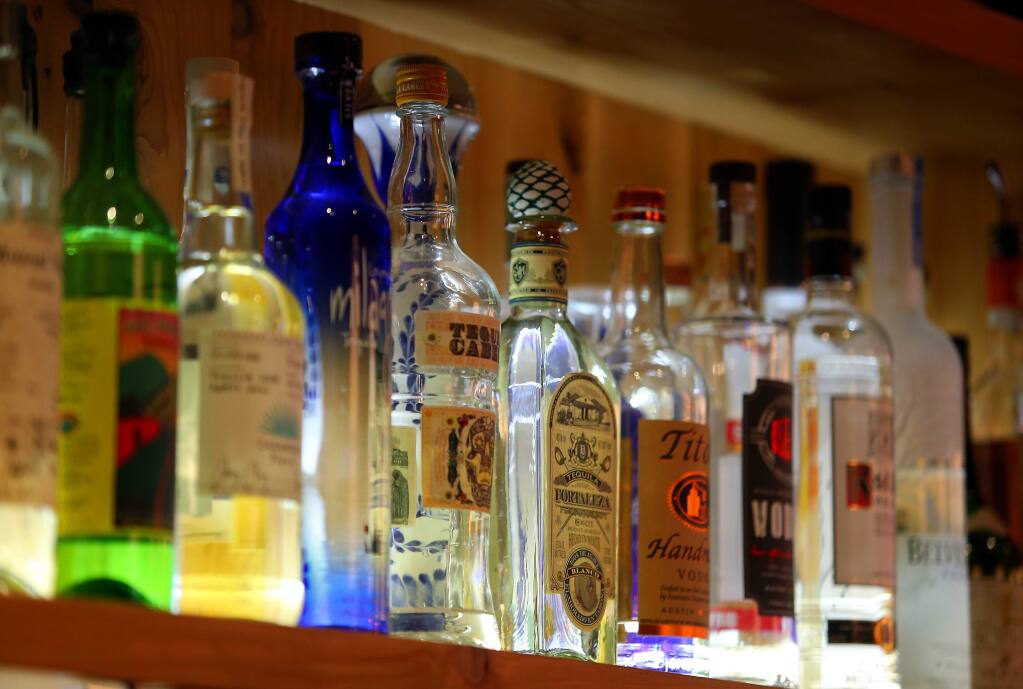 Bottles of alcohol behind the bar at Bravas Bar de Tapas, in Healdsburg.(Christopher Chung/ The Press Democrat)