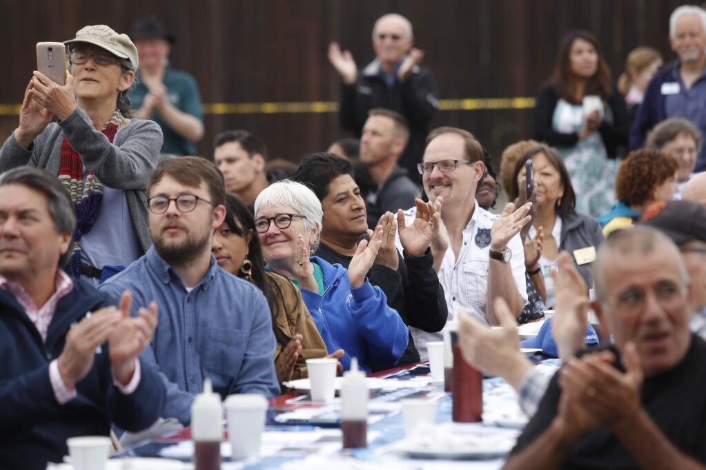 Attendees of the North Bay Labor Council's annual Labor Day Pancake Breakfast applaud all the workers, including emergency personnel and construction tradesman who helped during the October wildfires and during the rebuilding process. Photo taken at the Carpenters' Labor Center on Monday, September 3, 2018 in Santa Rosa, California . (BETH SCHLANKER/The Press Democrat)
