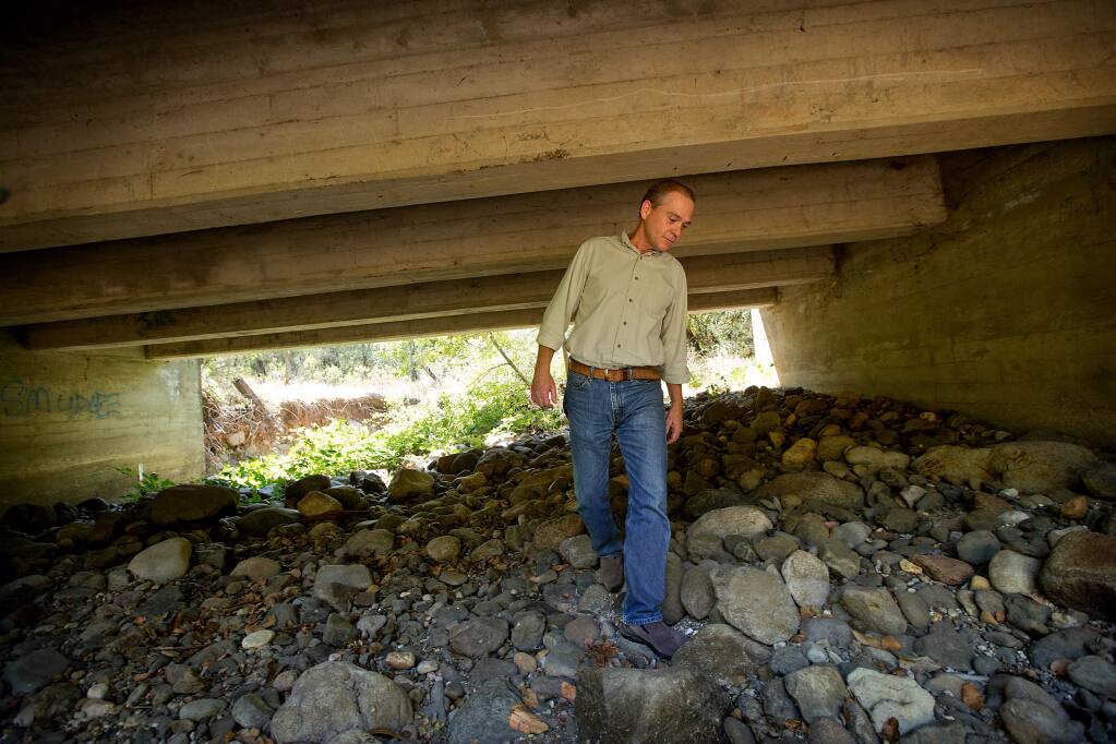 Sonoma Land Trust program manager Tony Nelson walks through a tunnel under Hwy 12 at Glen Oaks Ranch in Glen Ellen used by animals to travel under the busy highway. The Land Trust has received a grant for their work improving the wildlife passage between Napa and Marin. (JOHN BURGESS/The Press Democrat)