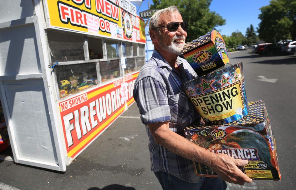 Chuck Coats of Sebastopol is pleased with his cache of fireworks, Thursday June 29, 2017 after purchasing them at the VFW Post 3919 fireworks stand in Sebastopol. (Kent Porter / Press Democrat) 2017