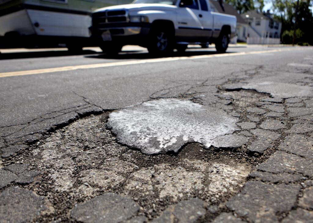 Petaluma, CA, USA. Tuesday, June 21, 2016._ A city survey asked residents about their priorities and majority of Petalumans were most concerned about potholes. (CRISSY PASCUAL/STAFF PHOTOGRAPHER)
