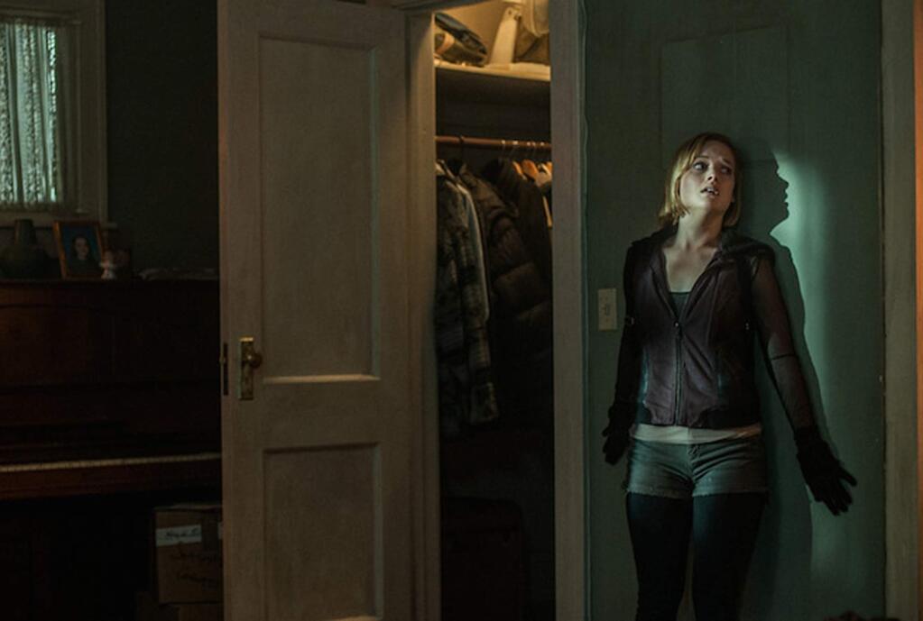 Jane Levy stars as one of a trio of thieves who break into a home of a blind man (Stephen Lang) thinking it will be an easy haul in 'Don't Breathe.' (SCREEN GEMS)