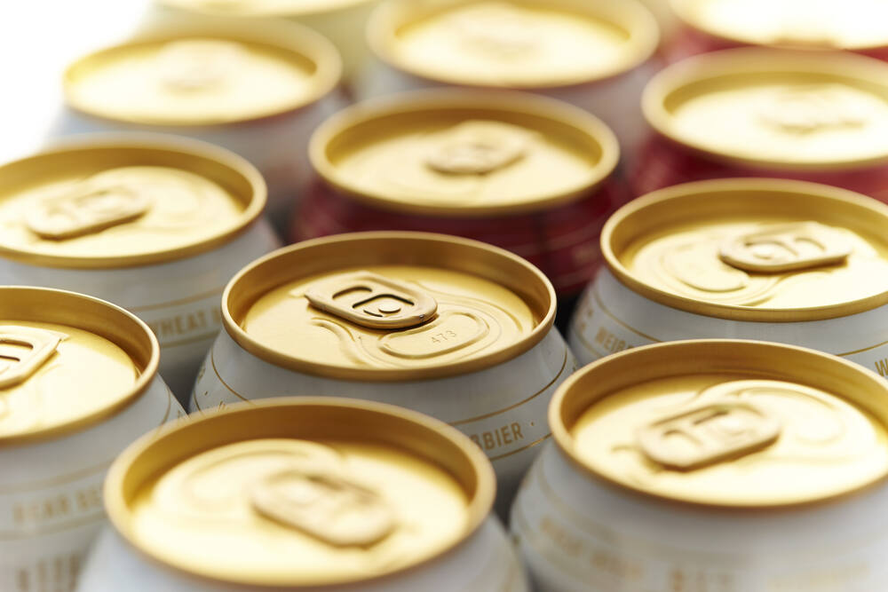 Backlit tops of beer cans (Nnimage / Shutterstock)