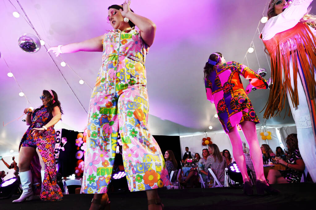 Members of the Active 20-30 Club performing during the 20th annual Catwalk For A Cure, a benefit for Sutter Health cancer screening and support services held at Luther Burbank Center for the Arts in Santa Rosa, Calif., on Friday, October 7, 2022. (Erik Castro / For The Press Democrat)
