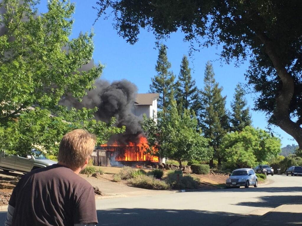 A fire damaged a home on Las Mesitas Drive in Santa Rosa on Sunday, June 28, 2015. (PHOTO: JULIE GOLDZMAN)