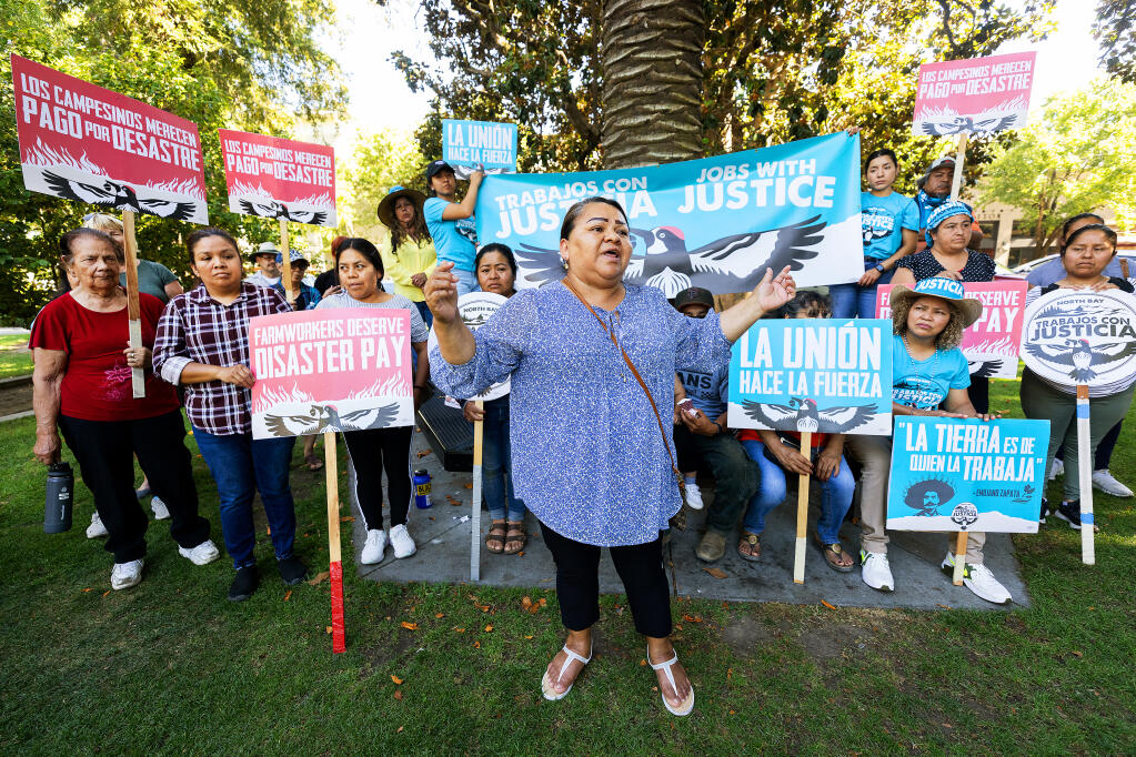 Ana Salgado, vice president with North Bay Jobs with Justice, speaks at a press conference in Healdsburg after farmworkers were awarded $328,077 from Mauritson Farms for retaliating after they spoke out about unfavorable working conditions, Monday, July 24, 2023. (John Burgess / The Press Democrat)
