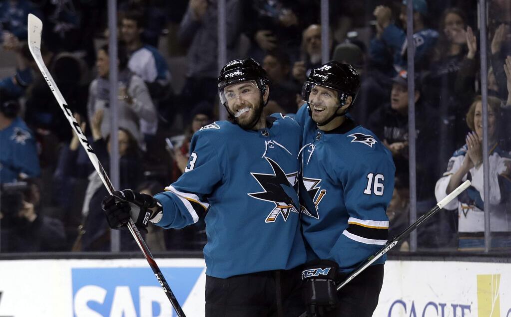 The San Jose Sharks' Barclay Goodrow, left, celebrates his goal with teammate Eric Fehr during the second period against the New Jersey Devils on Tuesday, March 20, 2018, in San Jose. (AP Photo/Marcio Jose Sanchez)