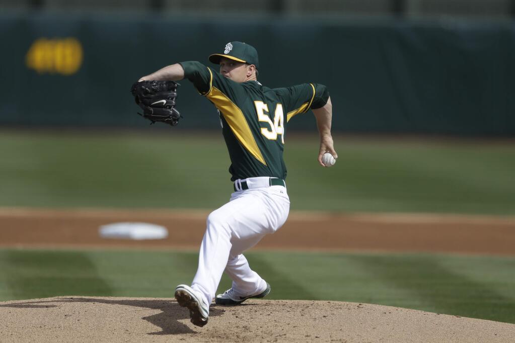 Oakland Athletics starting pitcher Sonny Gray throws against the Texas Rangers during the first inning of a spring training game Saturday, March 1, 2014, in Phoenix. (AP Photo/Gregory Bull)