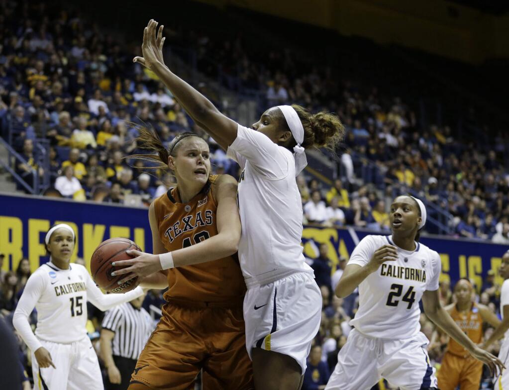 Texas center Kelsey Lang, left, is defended by California forward Reshanda Gray during the first half of a women's college basketball game in the second round of the NCAA tournament Sunday, March 22, 2015, in Berkeley, Calif. (AP Photo/Marcio Jose Sanchez)