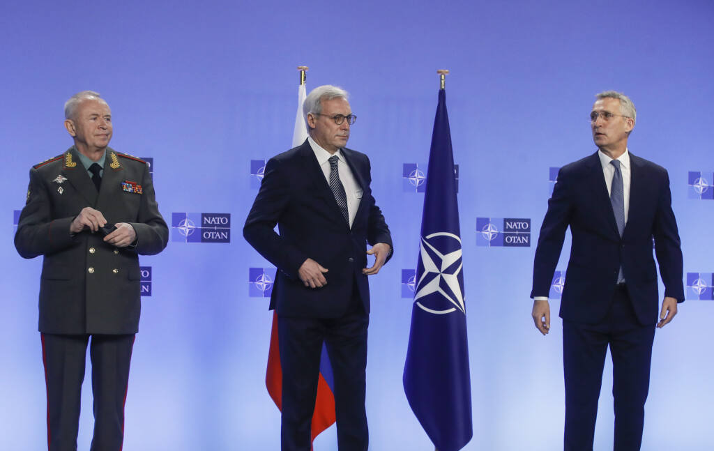 NATO Secretary General Jens Stoltenberg, right, welcomes Russia's Deputy Foreign Minister Alexander Grushko, center, and Russia's Deputy Defense Minister Alexander Fomin prior to the NATO-Russia Council at NATO headquarters, in Brussels, on Jan. 12, 2022. The failure of last week's high-stakes diplomatic meetings to resolve escalating tensions over Ukraine has put Russia, the United States and its European allies in uncharted post-Cold War territory. (Olivier Hoslet, Pool Photo via AP)