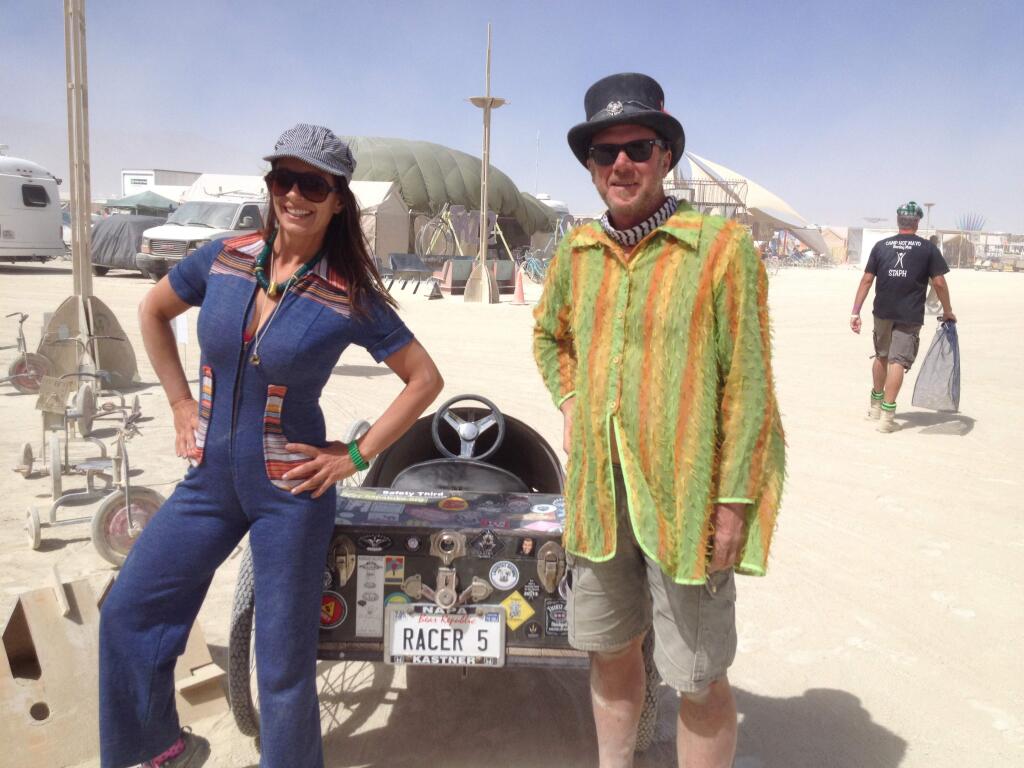 Scenes from Burning Man, Thursday, Sept. 1, 2016. Laurel Eastman of Santa Rosa and Andrew Spencer of Napa. Why the Racer 5 license plate? 'I just really like the beer,' Spencer said. (Chris Smith / Press Democrat)