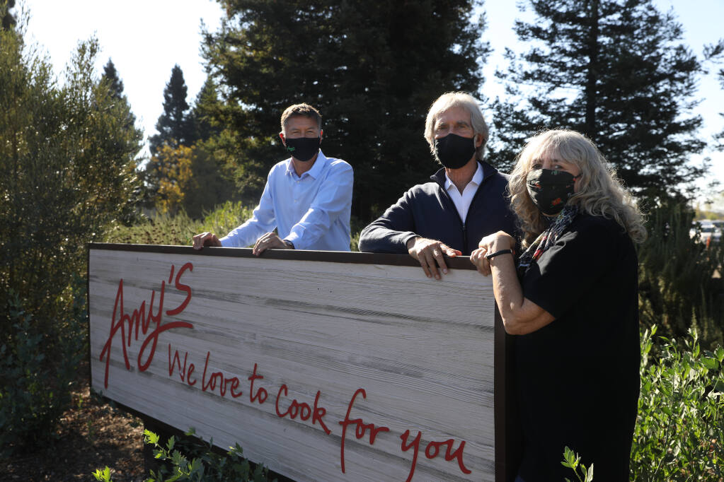 From right, Amy's Kitchen owners Rachel and Andy Berliner with the CEO Xavier Unkovic at Amy's Kitchen production facility in Santa Rosa on Tuesday, Oct. 20, 2020. (Beth Schlanker/ The Press Democrat)