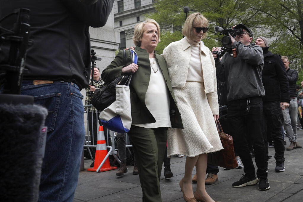 Former advice columnist E. Jean Carroll, right, leaves federal court with her lawyer Roberta Kaplan, Thursday, April 27, 2023, in New York. Donald Trump's lawyer sought Thursday to pick apart a decades-old rape claim against the former president, questioning why accuser E. Jean Carroll did not scream or seek help when Trump allegedly attacked her in a department store. (AP Photo/Bebeto Matthews)