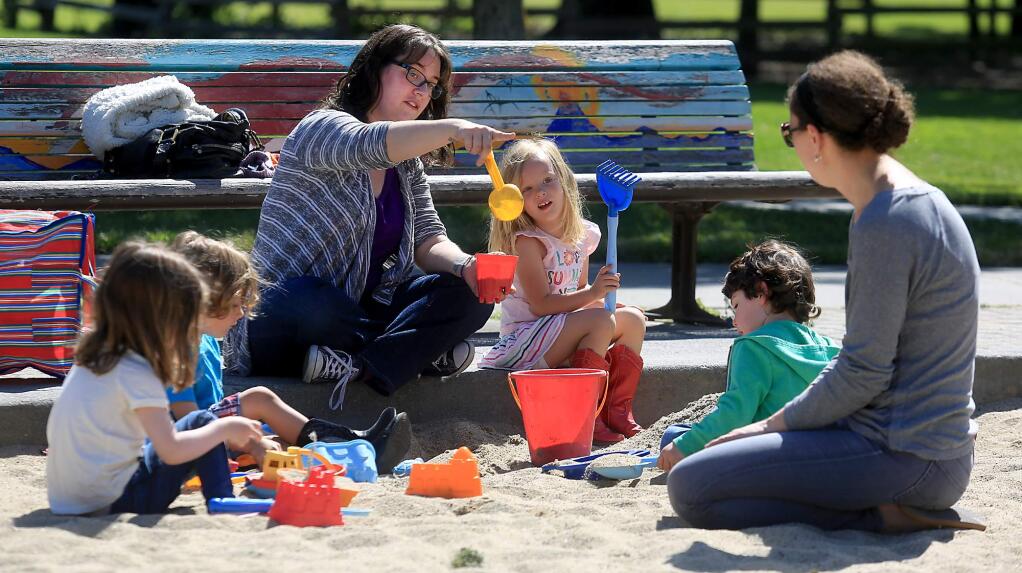 Jillian Leach, left, and Ann Rice play with their twins, from left, Quinn Rice, Merrick Leach, Kerensa Leach and Ryna Rice at finley Park in Santa rosa, Tuesday May 9, 2017 in Santa Rosa. (Kent Porter / The Press Democrat) 2017