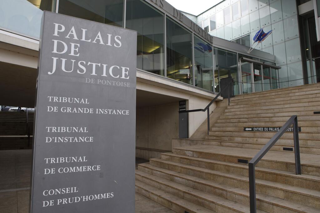 The entrance of the hall of justice is pictured Tuesday, Feb.13, 2018 in Pontoise, outside Paris. A 29-year-old man is set to appear in a French court Tuesday for having sex with an 11-year-old girl last year, in a trial that has rekindled debate on the age of sexual consent in France. In a decision that shocked many, the prosecutor's office in the Paris suburb of Pontoise decided to send the man to trial on charges of 'sexual abuse of a minor under 15 years old,' and not rape. (AP Photo/Francois Mori)