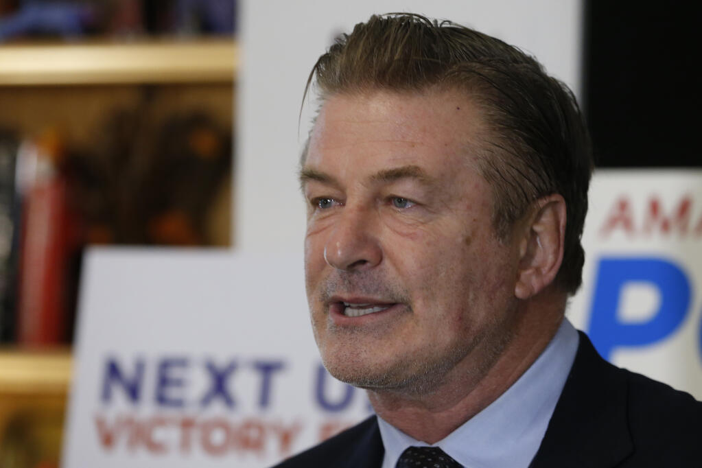 FILE - Actor Alec Baldwin, speaks to supporters of Amanda Pohl, candidate for Virginia Senate District 11 in her home in Midlothian, Va., Tuesday, Oct. 22, 2019. Prosecutors announced Thursday, Jan. 19, 2023 they are charging Baldwin with involuntary manslaughter in fatal shooting of cinematographer on movie set. (AP Photo/Steve Helber, File)