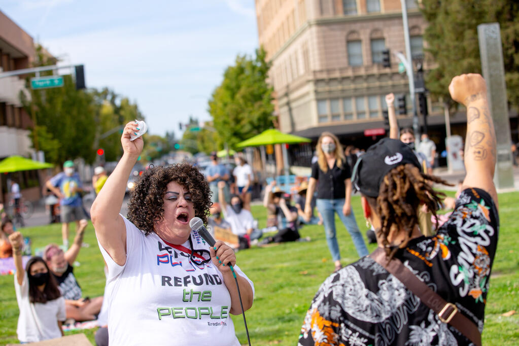 Delashay Carmona Benson, left, leads attendees in a chant during a Black Lives Matter rally at Old Courthouse Square in Santa Rosa on Saturday, Sept. 26, 2020. (Alvin A.H. Jornada / The Press Democrat)