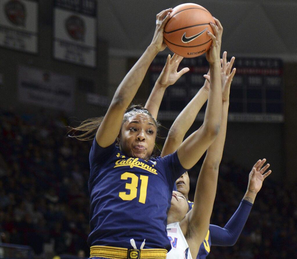 Cal's Kristine Anigwe comes down with a rebound in the second half against Connecticut Friday, Nov. 17, 2017. (AP Photo/Stephen Dunn)