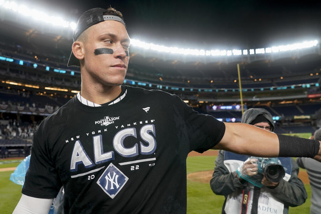 New York Yankees center fielder Aaron Judge walks off the field after celebrating with teammates after the Yankees defeated the Cleveland Guardians Game 5 of an American League Division baseball series, Tuesday, Oct. 18, 2022, in New York. (AP Photo/John Minchillo)