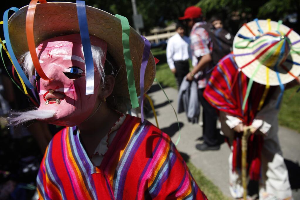Dancers from Ballet Folklorico Quetzalen wait to perform a traditional dance from Michoacan, Mexico during a Cinco de Mayo festival at the Sonoma Plaza on Sunday, May 1, 2016 in Sonoma. (BETH SCHLANKER / The Press Democrat)