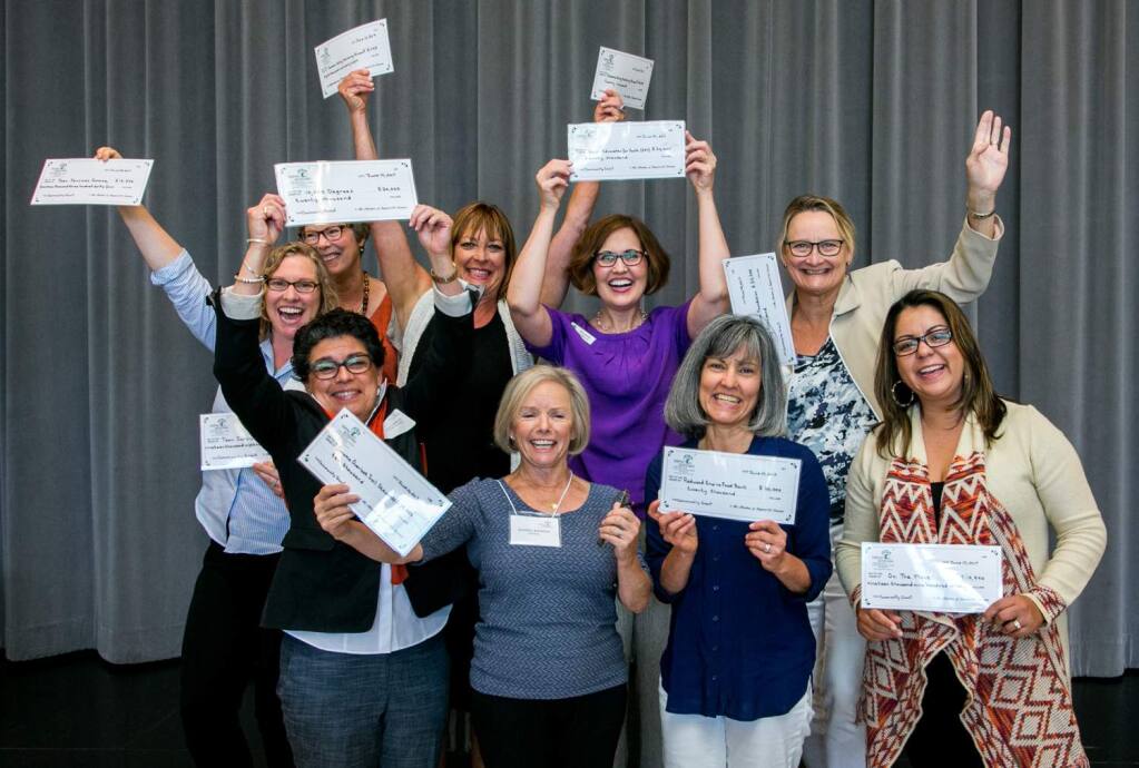 Representatives of Sonoma nonprofits celebrate receiving their checks from Impact100 Sonoma in 2017.