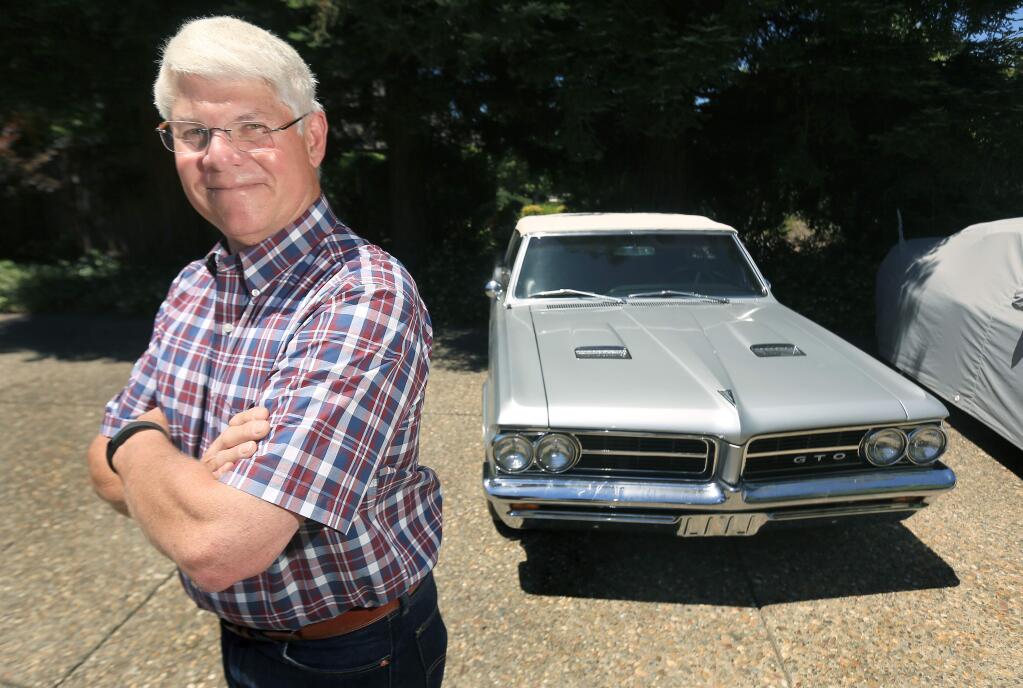 Former Sonoma County Sheriff Mark Ihde is all smiles after he helped detectives track down his stolen 1964 GTO convertible, Friday June 12, 2015. The GTO was stolen from his work parking lot in February. (Kent Porter / Press Democrat) 2015